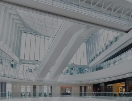 Multi-story shopping centre with escalators | Tyco Illustra Cameras